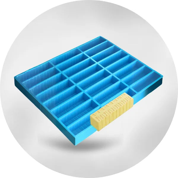 Blue silicone rectangular bar mold tray with multiple narrow cavities, shown with finished yellow bar pieces for size reference.
